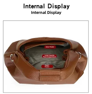 Internal view showing lychee leather bag with spacious main pocket and zippered compartment