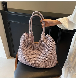 Detail view of light purple woven tote bag with soft texture and sturdy dual handles