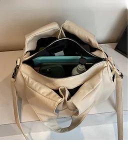 Top view of cream PU shoulder bag interior showing large capacity for tablet and phone