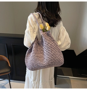 Close-up of light purple woven tote bag with a detailed textured pattern for summer vacations