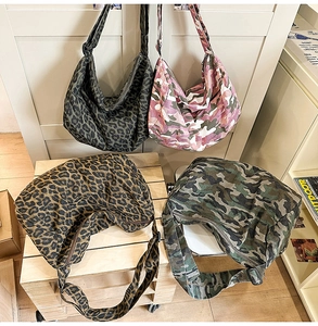 Detailed collection of leopard and camo canvas crossbody bags with wide straps