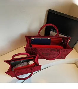 Interior view of red bridal tote bag showing large capacity and internal compartments