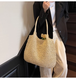 Detail of hand-woven beige tote bag texture and large interior space for daily commuting