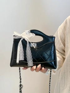 Quilted black leather handbag with white lace bow and silver chain strap for women