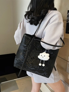 Fashionable black snake embossed leather tote bag with white cloud plush pendant charm