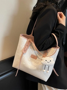 White snakeskin embossed tote bag with pink trim and cute plush cloud pendant charm