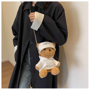Brown teddy bear plush crossbody bag featuring a white hoodie and a golden metal chain