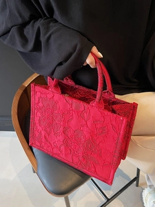 Elegant red bridal tote bag with floral embroidery and dual handles for weddings