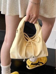 Hellgelbe Handtasche mit Schleife aus PU-Leder, Metallperlen und NO FILTER Etikett