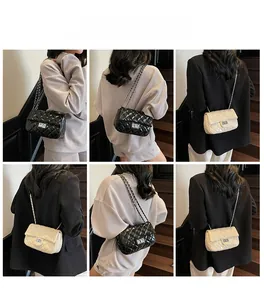 Quilted crossbody bag with chain strap and metal lock shown on model's back and side