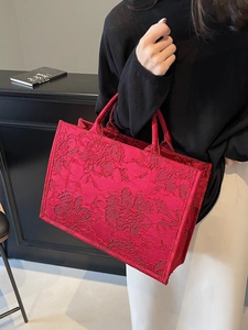 Red large capacity wedding tote bag with embossed floral texture and top handles