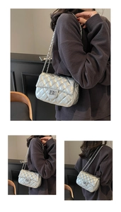 Silver quilted crossbody bag with metal chain strap and rectangular turn-lock detail