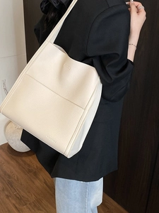 Fashionable off-white lychee texture tote bag for women showing spacious interior and strap