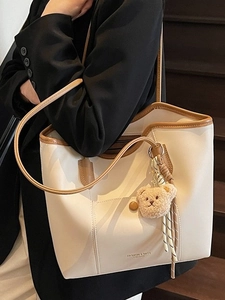 Large capacity beige tote bag with brown trim and cute teddy bear charm accessory