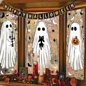 Detail of Halloween window clings featuring white ghosts, black bats and festive pumpkins