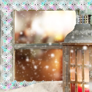 Holographic winter snowflake borders with cute smiley faces on a cozy window display