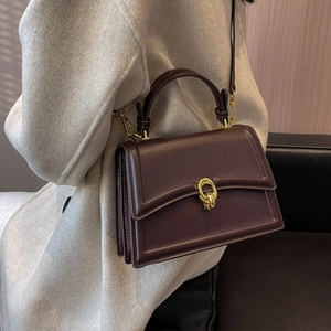 Dark brown leather square handbag with golden double-ring lock and top handle