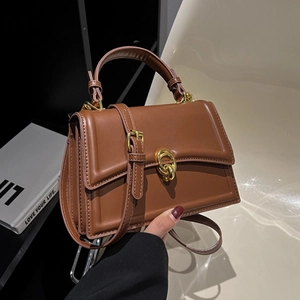 Classic caramel brown square bag with golden ring lock and versatile shoulder strap