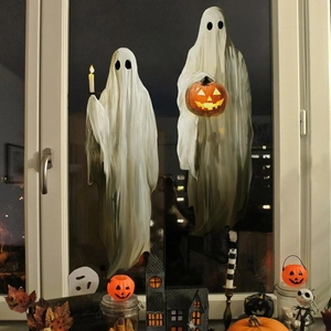 Halloween window stickers featuring spooky white ghosts with glowing pumpkin lantern