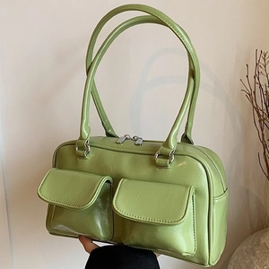 Chic avocado green tote bag with dual front pockets and glossy leather finish