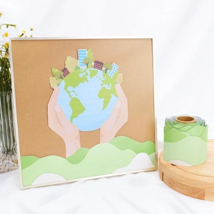 Detail showing eco-themed bulletin board border and hand-drawn Earth day paper cutouts