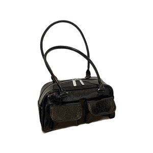 Minimalist black vintage tote bag with glossy finish and two front pockets on white background