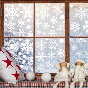 Detailed view of white snowflake static window decals with festive winter holiday decor