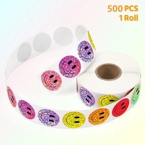 Close-up of 500 glittering smiley face reward stickers on a roll with colorful foil texture