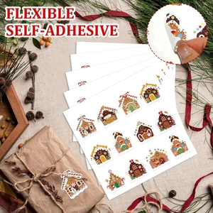 Detailed view of flexible self-adhesive gingerbread house Christmas stickers on gift box