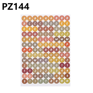 Detail view of colorful round alphabet and number stickers for school DIY projects