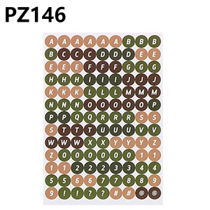 Macro view of colorful retro forest palette letter and number stickers for DIY crafts