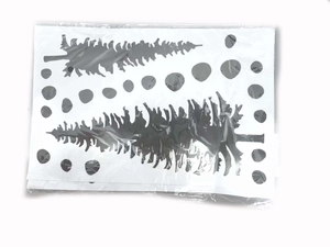 Detail of waterproof Christmas tree and polka dot wall stickers in clear plastic packaging