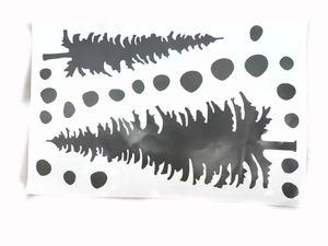 Detail of waterproof black ink-style Christmas tree stickers and polka dot decals