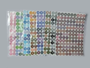 Close-up of colorful waterproof round alphabet and number stickers for school DIY projects