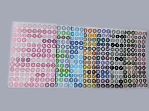 Detailed view of colorful round letter and number stickers for teacher DIY classroom decor
