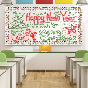 Close-up of festive Christmas bulletin board borders with snowman pattern on classroom whiteboard