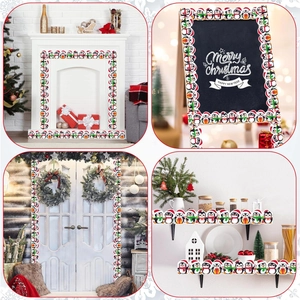 Detail of Christmas penguin borders decorating fireplace, chalkboard, door and shelves