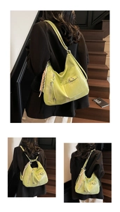Detailed view of the pistachio green glossy leather bag showing the versatile backpack straps