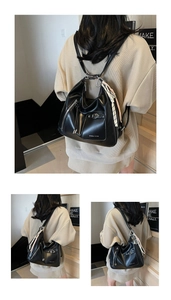 Detail of matte black leather tote showing versatile straps for backpack or shoulder wear