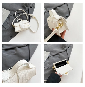 Detail view of white mini crossbody bag with lychee grain texture and gold hardware