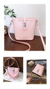 Detail der rosa Bucket Bag mit Krokodilmuster, silbernem Drehverschluss und Logo