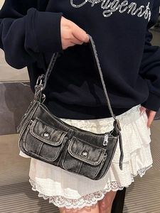 Fashionable denim underarm bag in washed dark grey with functional front flap pockets