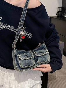 Retro washed blue denim underarm bag with metal heart charm and flap pockets