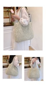 Detail of a large woven straw tote bag with dual handles for vacation and daily casual wear