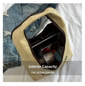 Spacious interior of a woven straw tote bag holding a tablet and summer essentials