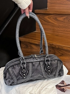 Washed denim Boston bag with vintage distressed finish and silver studs detail