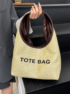 Minimalist straw woven tote bag with leather handles and TOTE BAG embroidery for summer