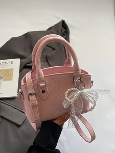 Pink lychee pattern bucket bag with pearl lace bow and adjustable shoulder strap