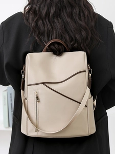 Minimalist beige anti-theft women backpack with brown leather trim in casual style