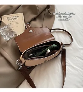 Detailed view of the spacious interior with zippered pocket for women's crossbody bag